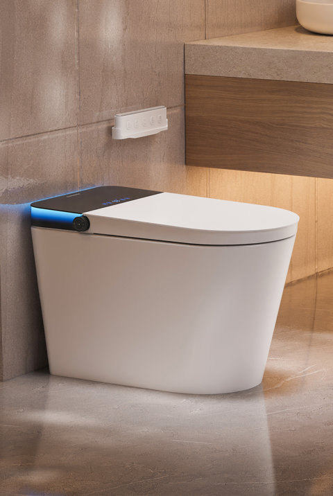 Modern white smart toilet with a sleek black lid, blue ambient accent lighting, and a wall-mounted remote control in a contemporary bathroom.