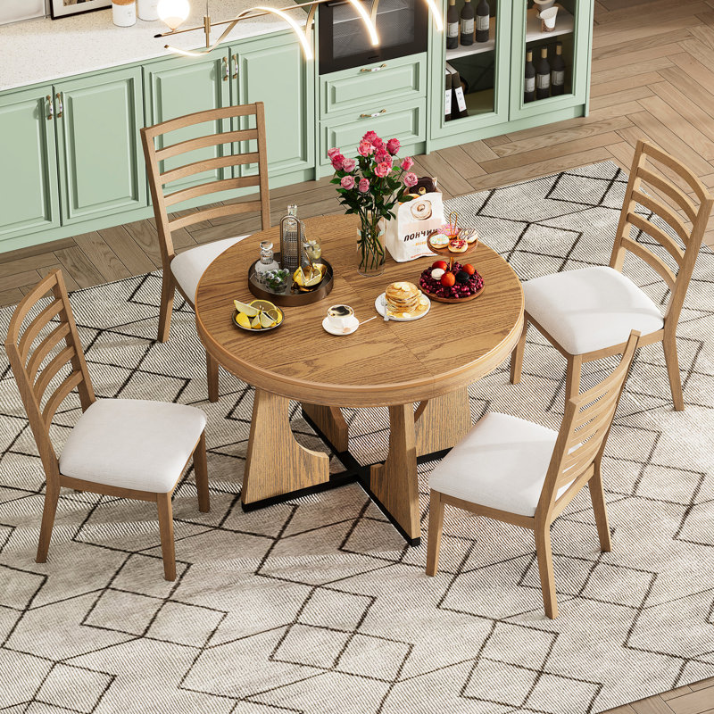 Table de salle à manger ronde pour 4 personnes, ensemble de 5 pièces au design rétro avec rallonge de 40 cm et structure géométrique. Plateau et quatre chaises rembourrées élégantes.
