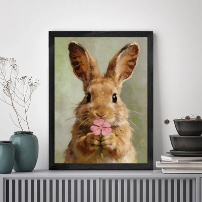 Oeuvre encadrée noire minimaliste prête à accrocher lapin rose fleur sa bouche élégante décoration murale pour les intérieurs contemporains