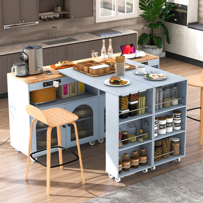 Îlot de cuisine avec table extensible, portes en verre cannelé, éclairage DEL, prises électriques et grande polyvalence, armoire électrique coulissante grise