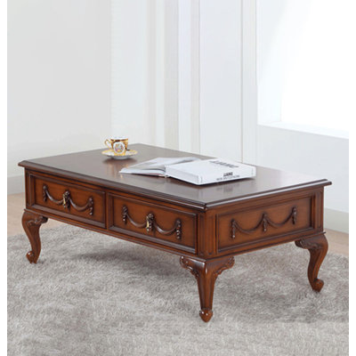 Carved mahogany coffee table