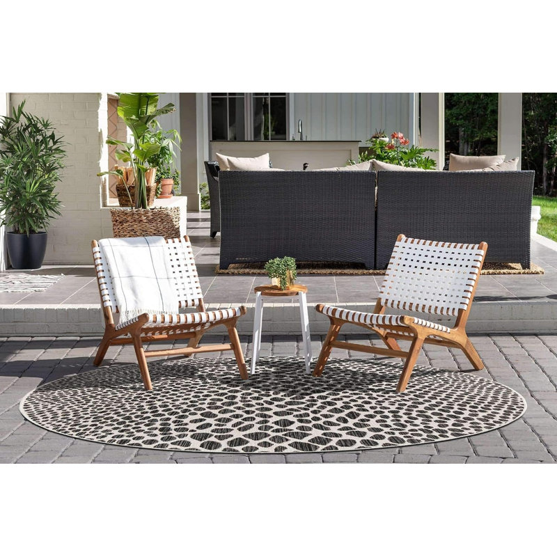 Tapis unique de la collection Outdoor (rond 4 pi 1 po, noir / ivoire)