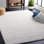 Tapis rayé ivoire / gris clair fait à la main Charvik