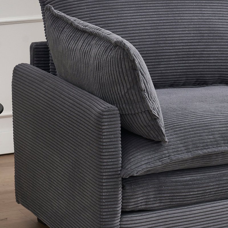 Canapé en velours gris foncé avec 2 coussins en tissu