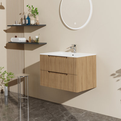 Meuble-lavabo mural avec lavabo et système de fermeture en douceur, offrant beaucoup de rangement et une conception moderne pour une salle de bain sans encombrement