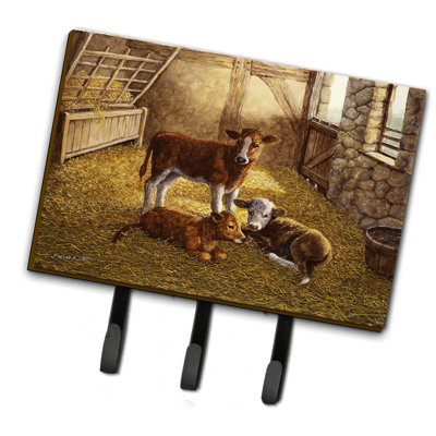 Les veaux de vache dans l’organisateur de la clé murale de grange avec crochets clés