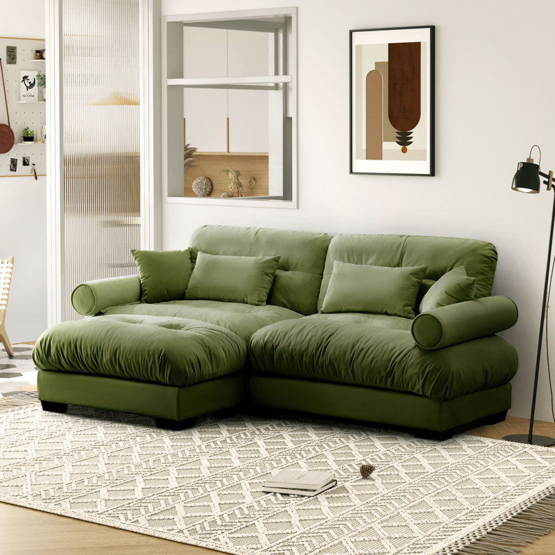 Modern Velvet Three-Seater Sofa With Cylindrical Armrests, Waist And Throw Pillows, Enveloping Seat Comfort, With Matching Ottoman.