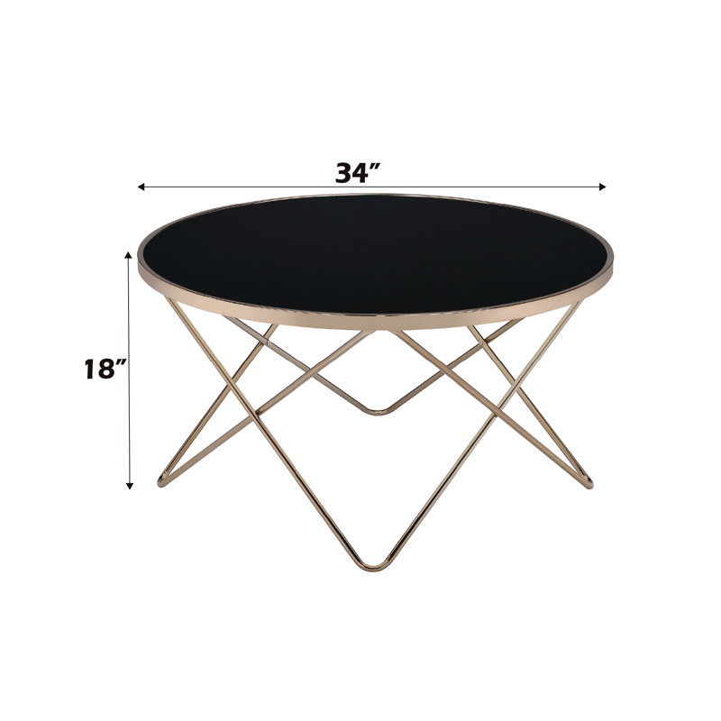 Table basse contemporaine en verre noir avec pieds champagne élégants