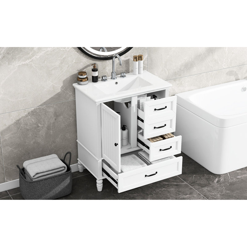 Meuble-lavabo de 76 cm (30 po) avec finition peinte en blanc, pieds en bois et portes à fermeture amortie. Meuble autoportant de 76 cm (30 po), lavabo en céramique, pieds réglables.