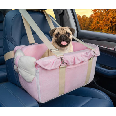 Fully detachable center console booster seat with adjustable straps; features decorative bow design; portable pet seat suitable for puppies and cats; pink finish.
