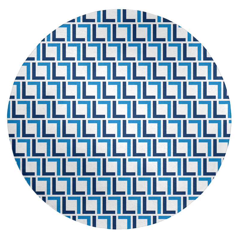 Tapis rond bleu à motif géométrique