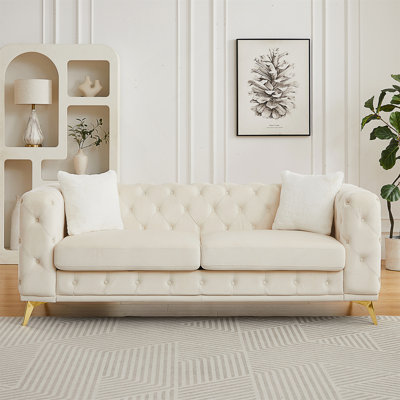 Chesterfield Style Velvet Sofa with Tufted Detailing and Throw Pillows