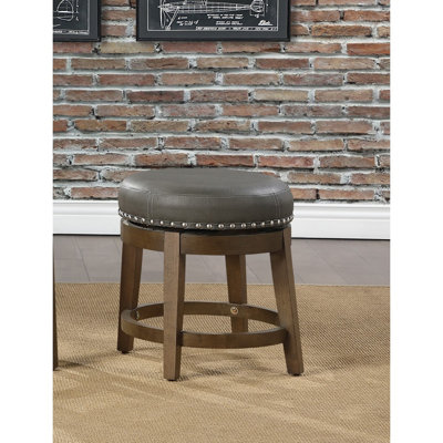 Ensemble de 2 tabourets ronds et pivotants, siège pivotant à 360 degrés en similicuir gris avec garniture cloutée et structure en bois massif à finition brune