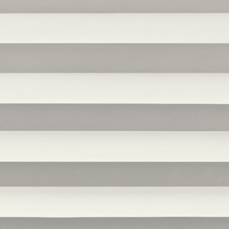 Rideau plissé blanc filtrant la lumière