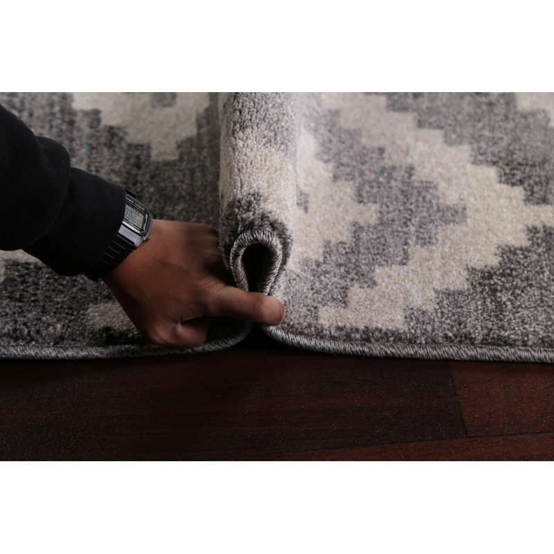 Tapis géométrique gris