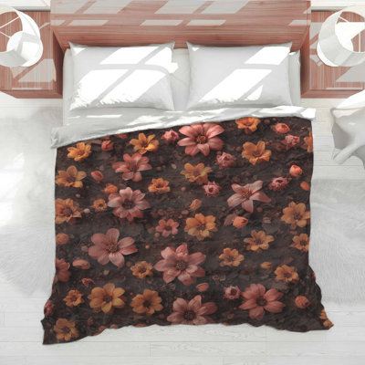Édredon orange, fleurs roses