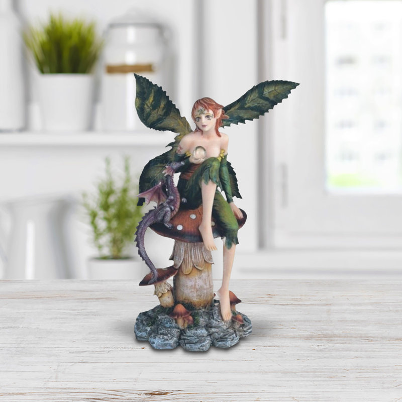Figurine fée verte 9 "avec un bébé dragon mauve assis sur un champignon
