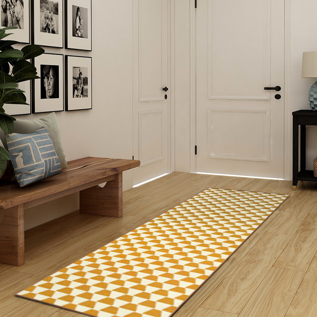 https://assets.wfcdn.com/im/29601896/compr-r85/1328/132840161/yanis-yellowgold-flatweave-performance-yellow-gold-rug.jpg