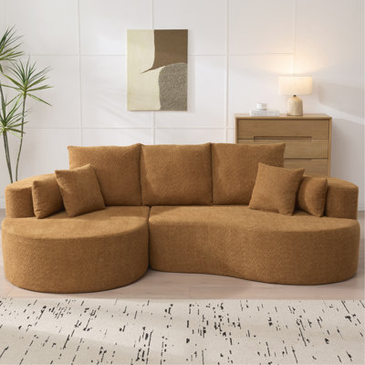 Canapé d'angle incurvé 4 places (269 cm) en tissu bouclé, couleur Nomad, garni de mousse et de 7 coussins moelleux. Aucun assemblage requis. Composition : 2 pièces. Design confortable.