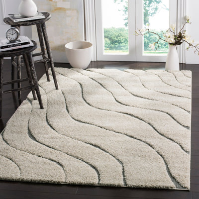 Ashal Animal Print Cream/Gray Area Rug