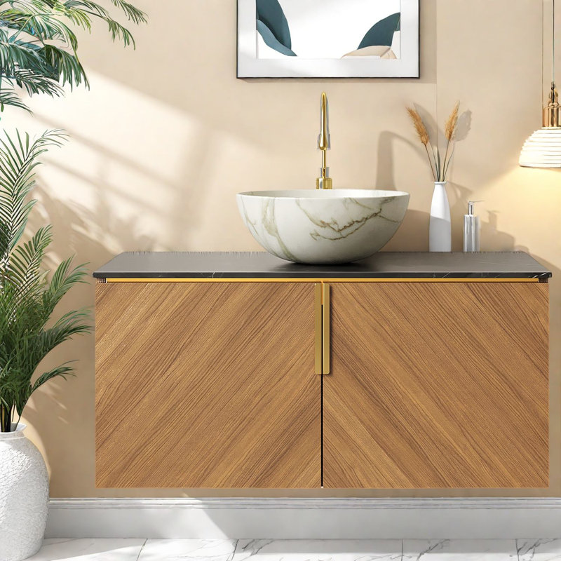 Ensemble de meuble-lavabo spacieux avec lavabo, comptoir en pierre noire au fini chêne brun
