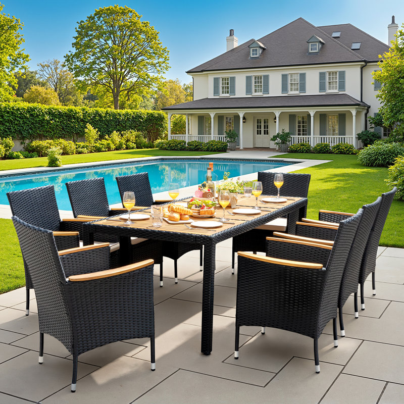 Callan 8 - Person Wicker Patio Dining Set with Rectangular Table , Cushions Included, Black