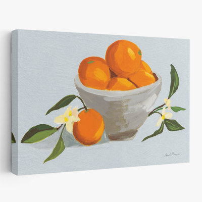 Oranges dans un bol gris - texture bleu - bol bleu en fleurs