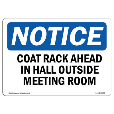Coat Rack Ahead in Hall outside Meeting Room Sign