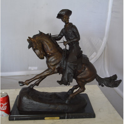 Aderyn Remington Cowboy on marble Bronze Statue -  Size: 24"L x 9"W x 23"H.
