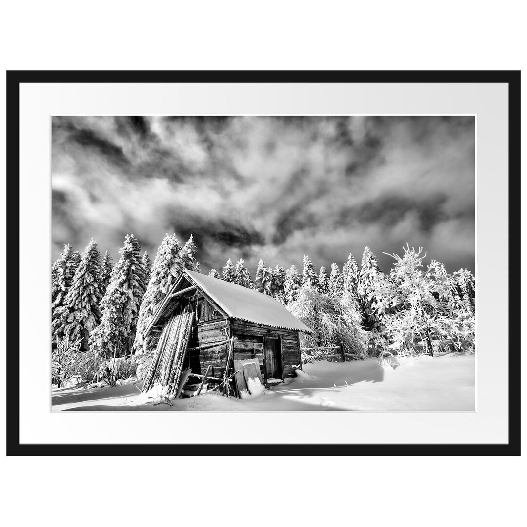 Gerahmtes Poster Holzhütte im Schnee