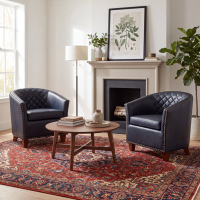 Fauteuil demi-tonneau en cuir moderne avec dossier capitonné à losanges et garniture cloutée