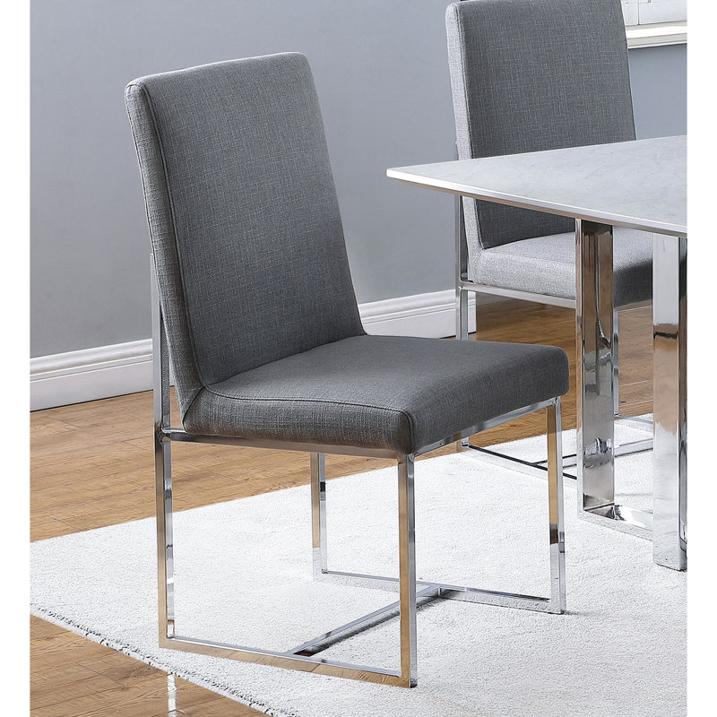 De 2 élégantes chaises rembourrées grises avec une structure en métal tendance pour la salle à manger