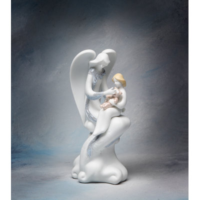 Figurine en porcelaine fine d'un ange gardien tenant un enfant - 20 cm de hauteur