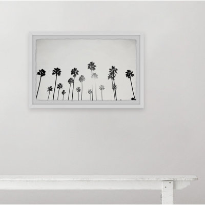Reproduction de photo encadrée « mass of palm is » sur papier