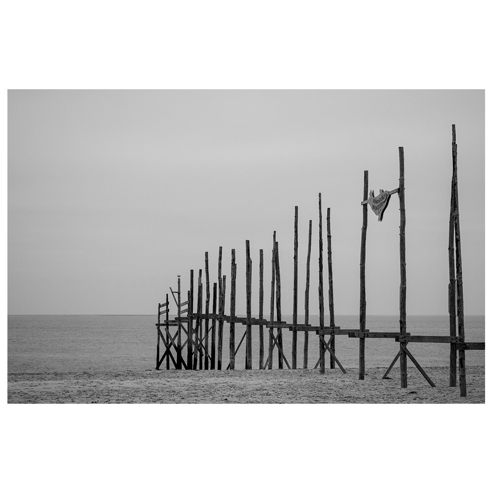 Leinwandbild Poles in the Sand