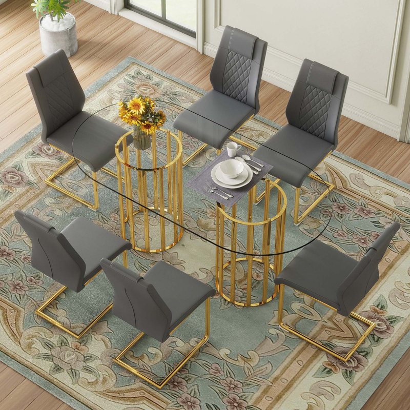 Ensemble de table et de chaises 9 pièces. Table de salle à manger ovale en verre trempé avec 8 chaises en polyuréthane de haute qualité