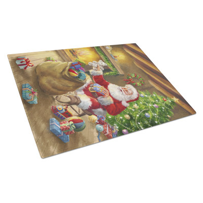 Caroline's Treasures Christmas Santa Claus Unloading Toys Glass Cutting Board