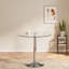 Table de salle à manger ronde en verre avec pieds en acier inoxydable argenté, sièges 4-6, design minimaliste moderne pour la cuisine ou le salon