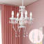 Lustre en cristal avec éclairage à chandelles blanches et roses 4 lumières