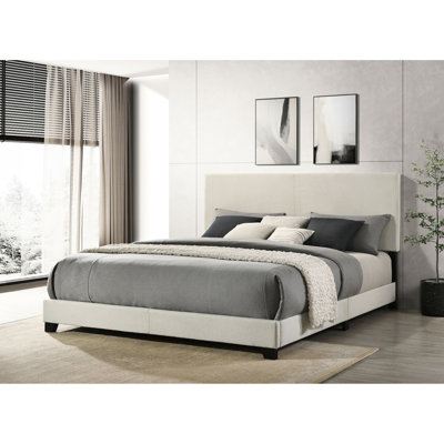 Luxueux lit de style oriental crème avec tête rembourrée et structure en bois de style transitionnel rembourré de style chambre à coucher