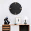Horloge murale noire minimaliste et ronde pour salon