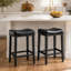 Ensemble de 2 tabourets de bar sans dossier, hauteur comptoir 65 cm, siège rembourré en cuir de 10 cm et clous décoratifs en laiton, noir