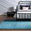 Tapis en polypropylène tissé à la machine à poils longs de couleur unie turquoise Fragos-1063882303