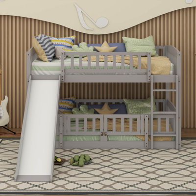 Lit superposé simple au-dessus de simple avec clôture, échelle et glissoire pour enfants adolescents