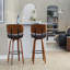 Tabouret de bar à hauteur fixe avec pivot en bois et similicuir avec repose-pieds rond en métal noir - ensemble de 2