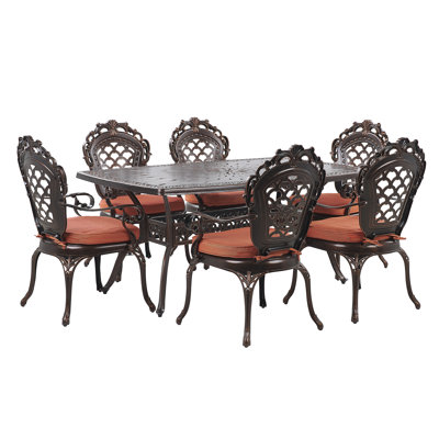 Fraley 6 - Person Patio Dining Set with Round Table , Cushions Included