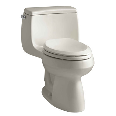 Toilette allongée une pièce à hauteur confort 1,28 GPF avec technologie de chasse Aquapiston et levier gaucher Gabrielle
