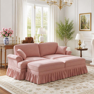 Canapé élégant de style Mid-Century, grand modèle, avec accoudoirs évasés, jupes à volants et plis amovibles et pieds fuselés, accompagné de 2 poufs amovibles.