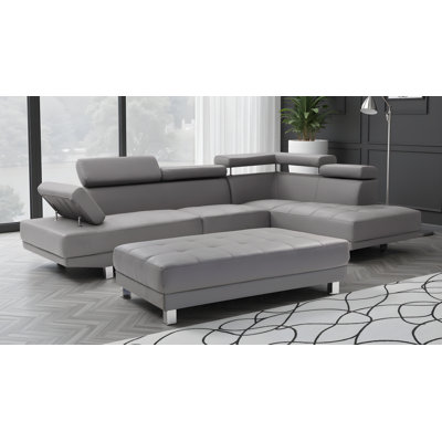 Farranshane White Faux Leather Sectional with Ottoman
