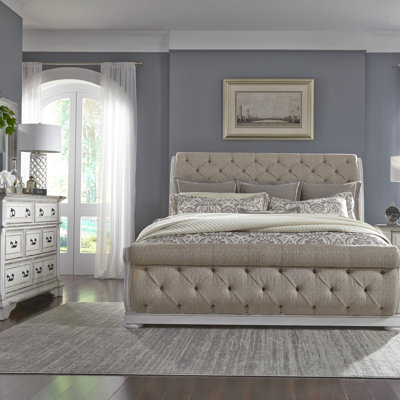 Grand lit-bateau tapissier, commode et miroir Tysheena